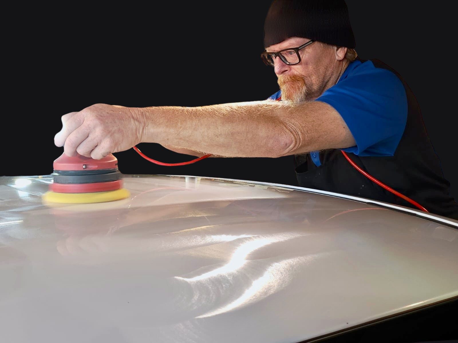 Richard Snow polishing a car roof